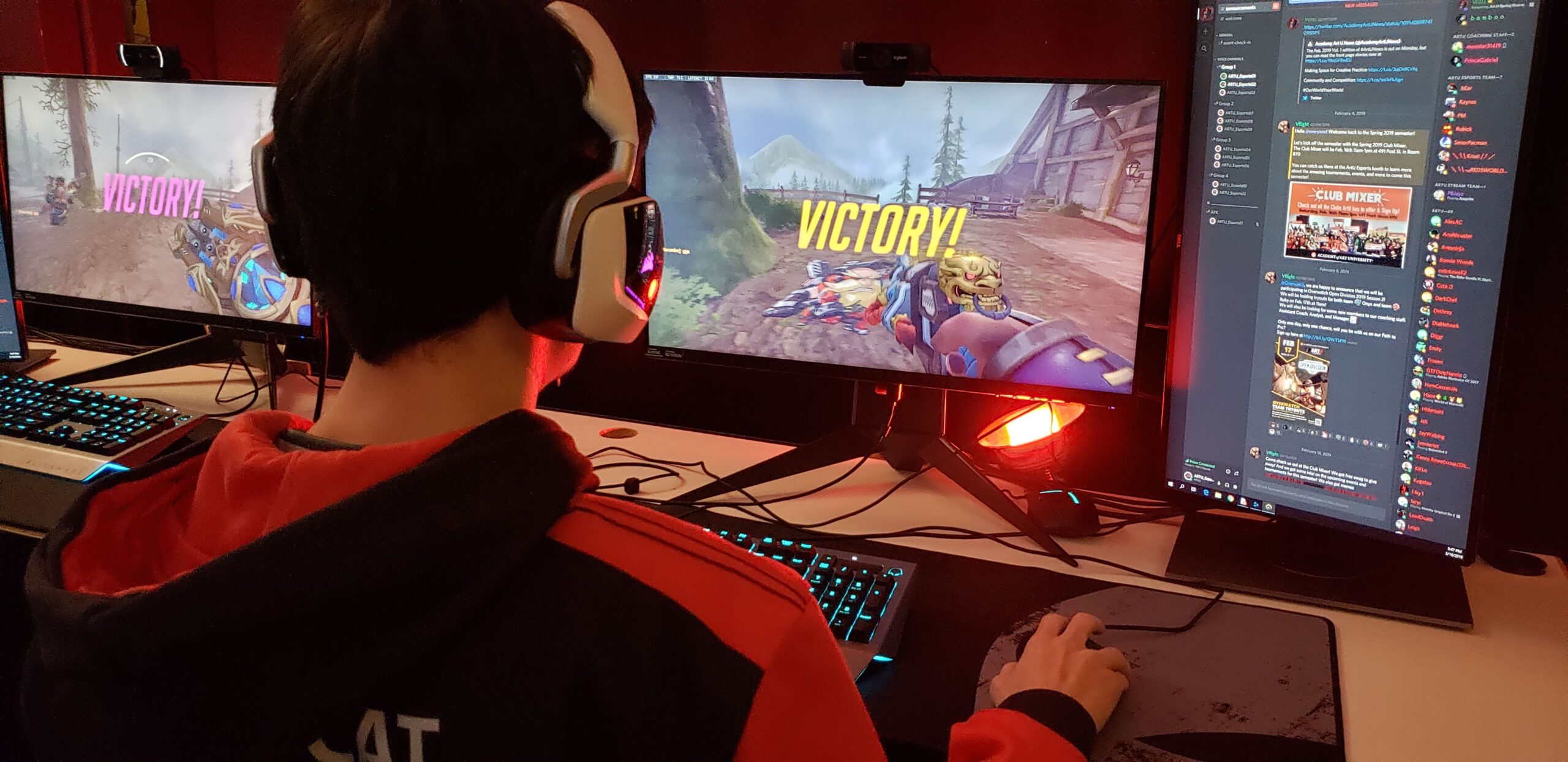 young man playing Overwatch at a computer